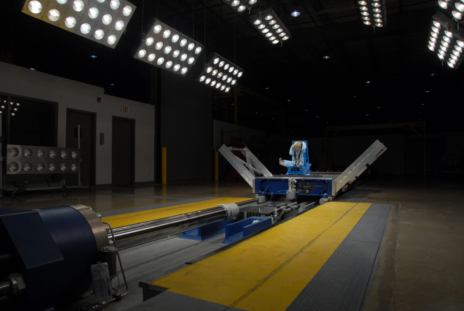 Child seat test dummy positioned on a crash test sled inside CAPE’s testing facility.