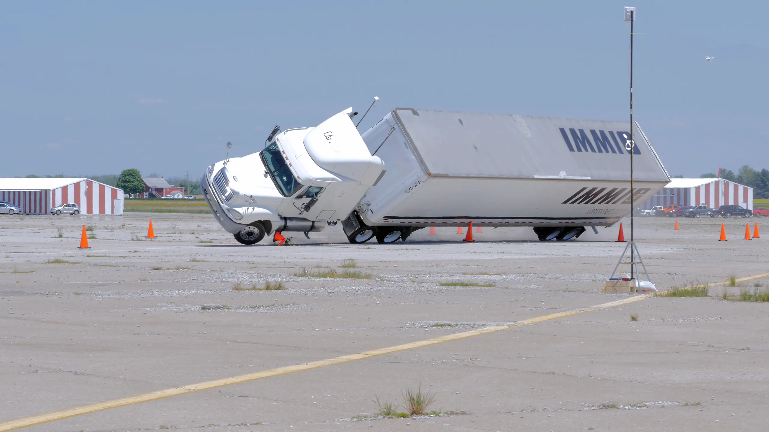 Tractor-trailer undergoing vehicle rollover testing